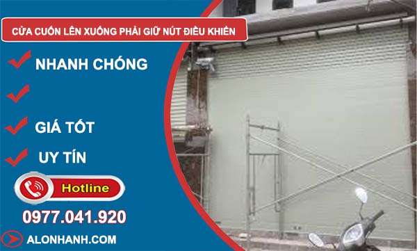 cửa cuốn lên xuống phải giữ nút điều khiển